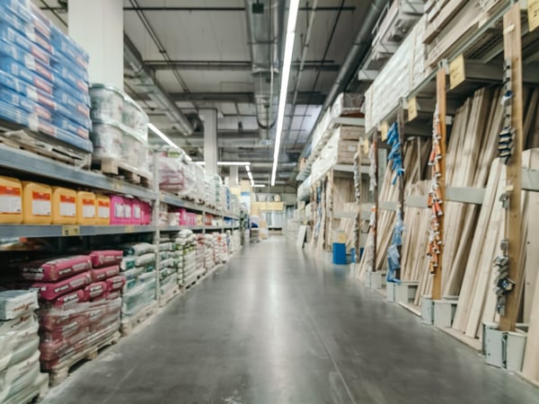 A warehouse aisle with home construction supplies.