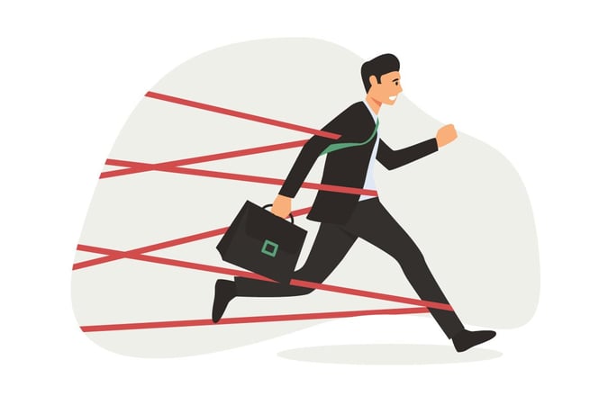 An illustration of a businessman running through red tape.